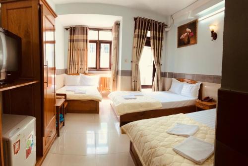 Katil atau katil-katil dalam bilik di Phước Thịnh Hotel