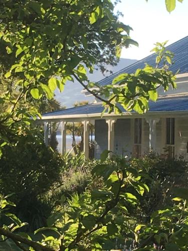 a house with a gazebo at Halfmoon Cottage in Akaroa