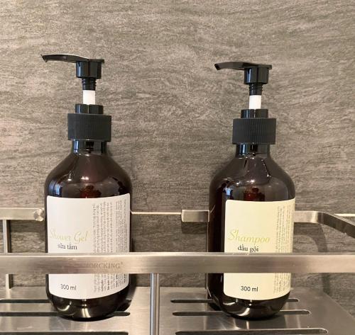 two bottles of wine sitting on a shelf at Conson Hotel in Con Dao