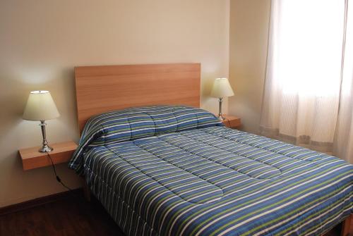 Säng eller sängar i ett rum på Apartamento Washington