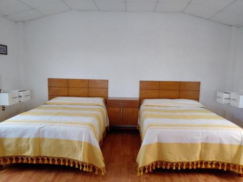 En eller flere senger på et rom på Cabaña de Rubén