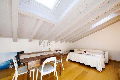a bedroom with a desk and a bed in a room at Apartment 23 in Como