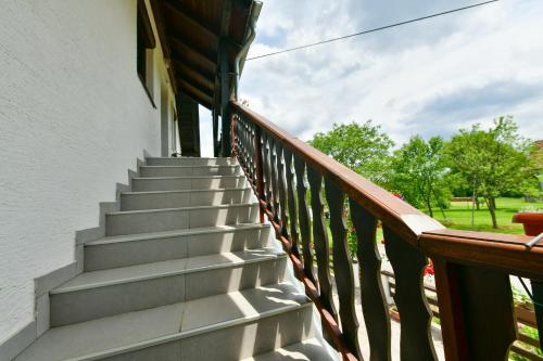 a set of stairs on a porch of a house at Apartment Ivano in Rakovica