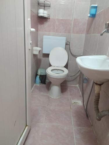 a bathroom with a toilet and a sink at Opium otel in Afyon