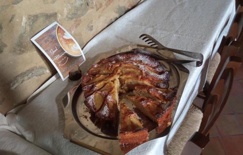 a cake on a plate on a table at Casa Vacanze Nicola e Lina in Tortorella