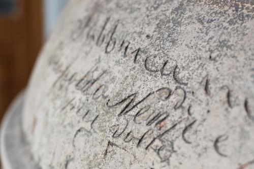 a stone vase with writing on the side of it at Agriturismo la Concezione in Castiglion Fibocchi