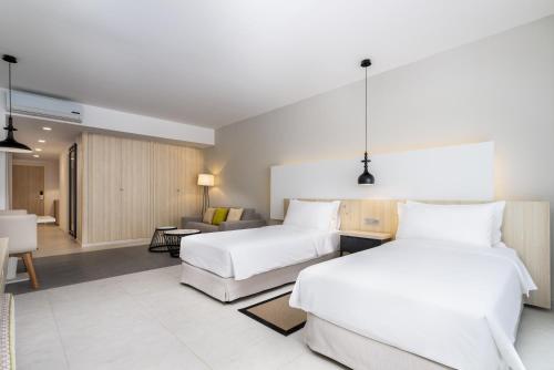 Un ou plusieurs lits dans un hébergement de l'établissement Radisson Blu Residences, Saidia