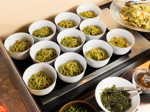 a group of white bowls of noodles on a tray at La'gent Hotel Kyoto Nijo in Kyoto