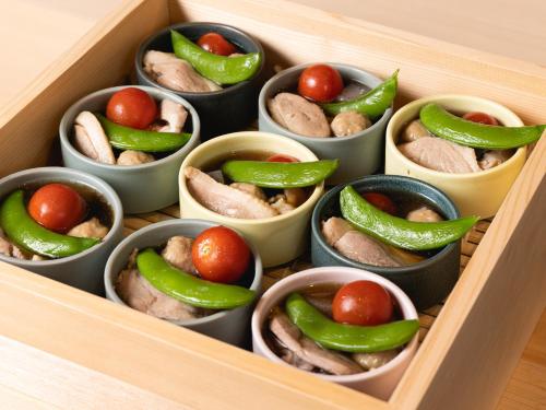 a wooden drawer filled with packets of food with peppers at La'gent Hotel Kyoto Nijo in Kyoto
