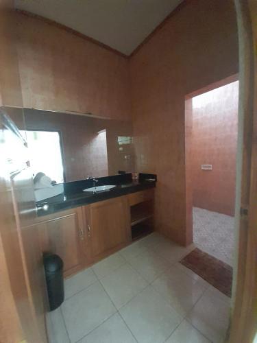Kuchyň nebo kuchyňský kout v ubytování Hôtel La Belle Etoile