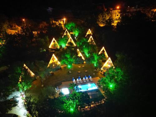 an overhead view of a christmas light display at night at BADEM AĞACI BUGALOWLARI in Kas