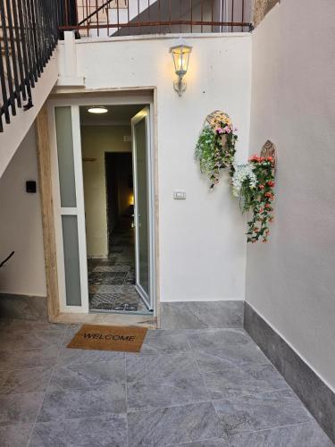 a hallway of a building with two wreaths on the wall at Appartamento Standard Plus in Massafra