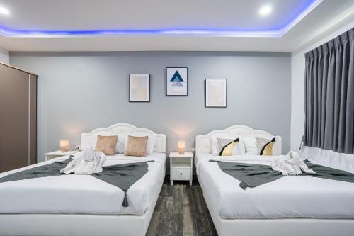 Katil atau katil-katil dalam bilik di NINE9 Luxury PoolVilla Pattaya walking street 3 Bedrooms