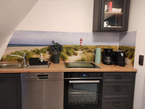 Küche/Küchenzeile in der Unterkunft Schöne Wohnung an der Nordsee in Mildstedt