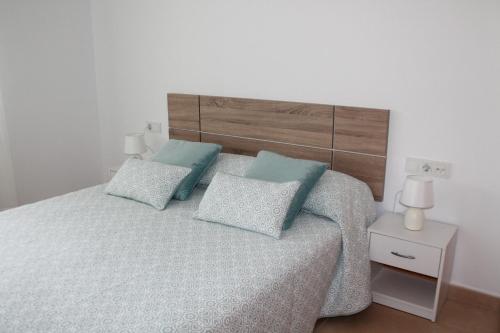 Ένα ή περισσότερα κρεβάτια σε δωμάτιο στο Apartamento nuevo en urbanización a 250 metros de la playa