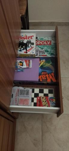 a drawer full of games on a table at Grapes and Roses in Igoumenitsa