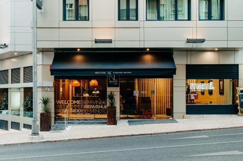 a store front of a building with a black awning at Next Level Premium Hotels in Lisbon