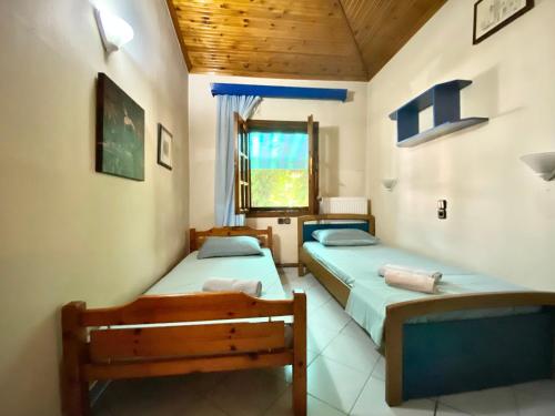 Postel nebo postele na pokoji v ubytování Platamon village house