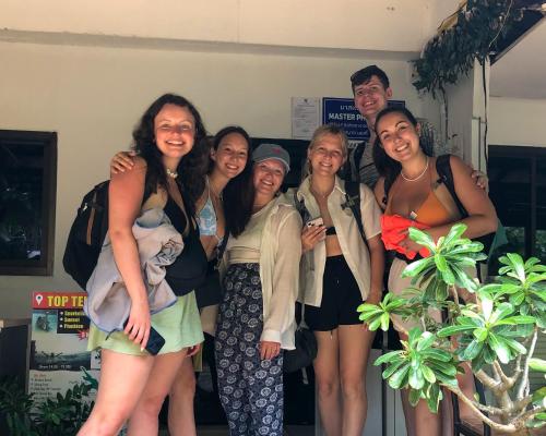 a group of people posing for a picture at Sweed Dee Hostel in Phi Phi Don