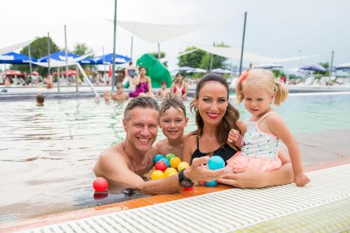 a group of people in the swimming pool at Hotel Castello & Thermal Spa Siklós in Siklós