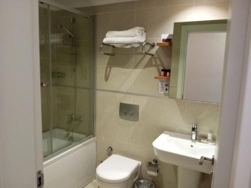 a bathroom with a toilet and a sink and a shower at Lander Luxury Apartment, 5 Star Hotel, Kusadasi in Kuşadası