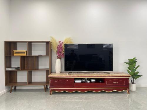 a living room with a television on top of a table at Blue Haven Retreat - Beverly Hills 208 in Sydney