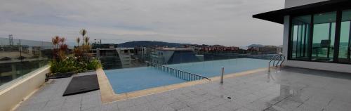a swimming pool on the roof of a building at Sky homestay in Kota Kinabalu
