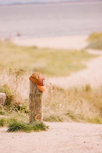 a hat on top of a wooden post at Dornoch Station in Dornoch