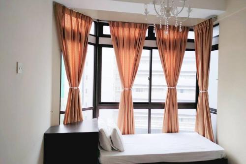 En eller flere senge i et værelse på Fahrenheit 88@Pavilion 3 Bedroom Bukit Bintang Fleur