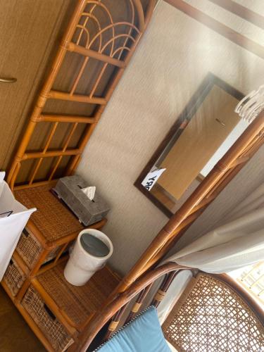 an overhead view of a room with a table and a chair at Sun Sea GuestHouse in Yomitan
