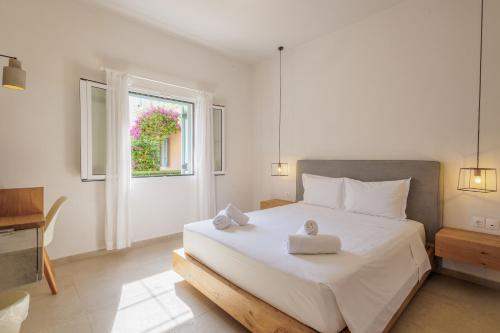 Postel nebo postele na pokoji v ubytování Satori Boutique Hotel
