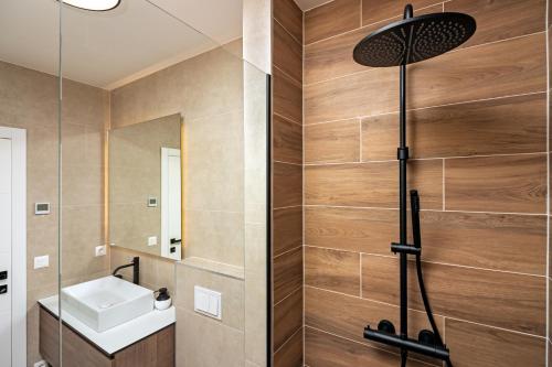 a bathroom with a shower and a sink at Family House "Villa Gyra" with Private Swimming Pool, Indoor BBQ, Gym and Gaming room! in Podstrana