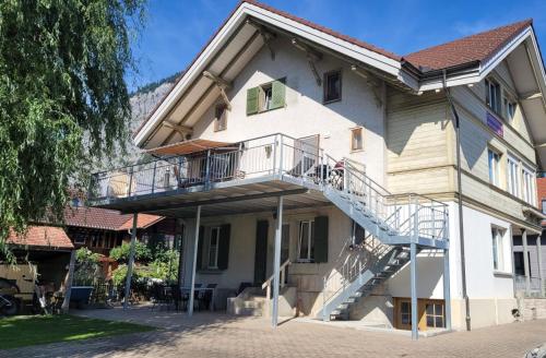 a building with a staircase on the side of it at Mountain Holiday in Wimmis