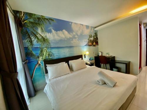 En eller flere senge i et værelse på Best View Hotel Sunway Mentari