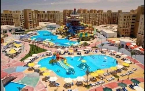 a rendering of a water park at a resort at استوديو فندقي مكيف وفيو رائع in Borg El Arab