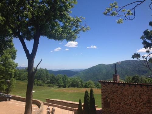 a view of the mountains from the top of a building at Hotel Boutique Puig Francó - Adults Only in Camprodon