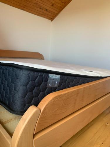 a mattress sitting on top of a bed at Tourist Farm Strle With Great Local Food in Cerknica