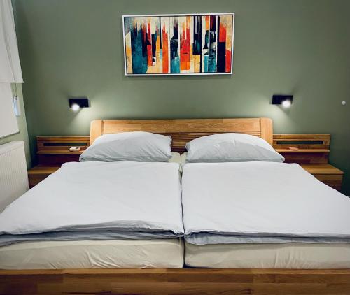 a bed with two white pillows in a bedroom at Apartmány Petr Vok in Třeboň