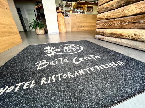 a rug on the floor of a store with a buffalo cant special restaurant at Wellness Hotel Ristorante Baita Cerato in Bolca