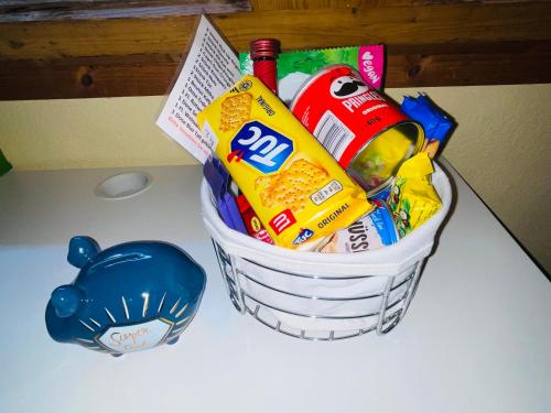 a basket filled with chips and snacks on a table at Bed-International in Roggwil