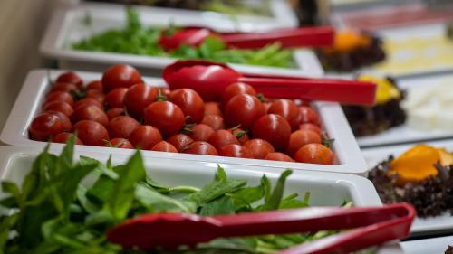 a display of tomatoes and other vegetables in trays at Grand Karot Hotel in Yalova