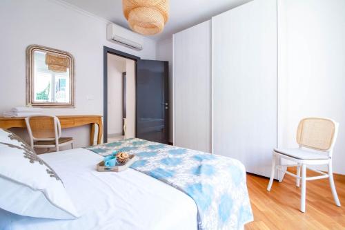 a bedroom with a bed and a table and chairs at Elios by PortofinoHomes in Portofino