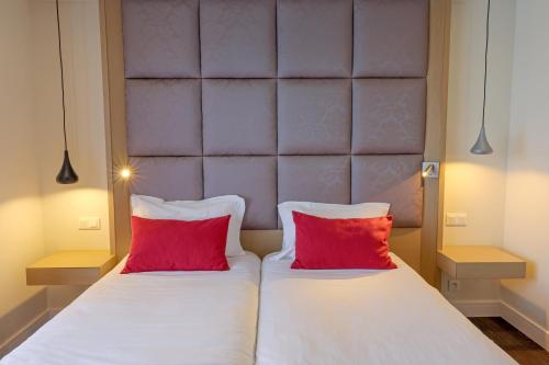 Katil atau katil-katil dalam bilik di Hotel Saint Christophe