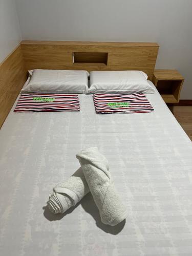 Postel nebo postele na pokoji v ubytování Ging-Ging Tourist Inn