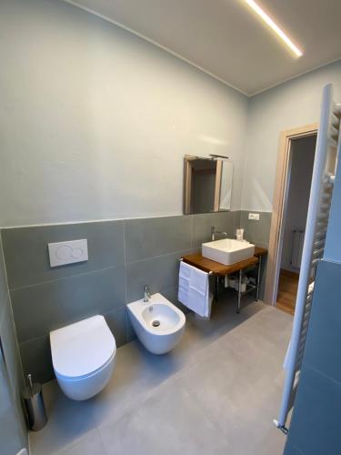 a bathroom with a toilet and a sink at Da Mary in Badia Prataglia