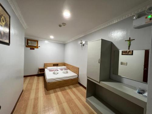 Postel nebo postele na pokoji v ubytování Ging-Ging Tourist Inn