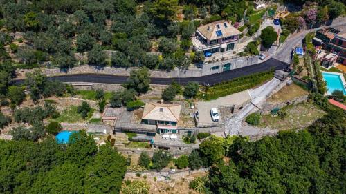 an aerial view of a house with a road and a bridge at Villa Pia Recco in Recco