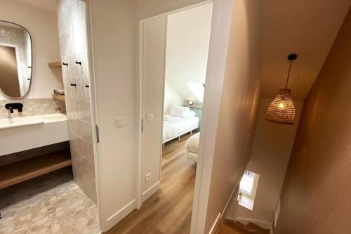a bathroom with a sink and a mirror at Lac's Lodge ¤ Maison coquette à 10min du lac in Annecy