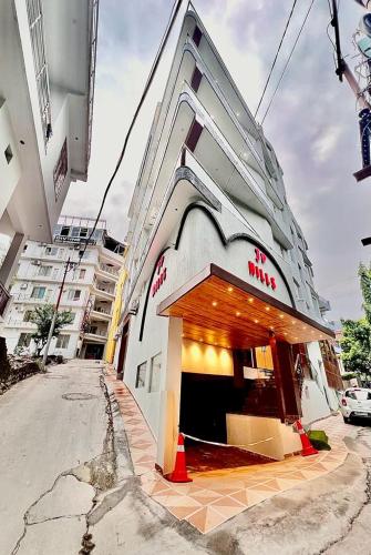 a store front of a building on a street at Hotel JP Hills Rishikesh in Rishīkesh