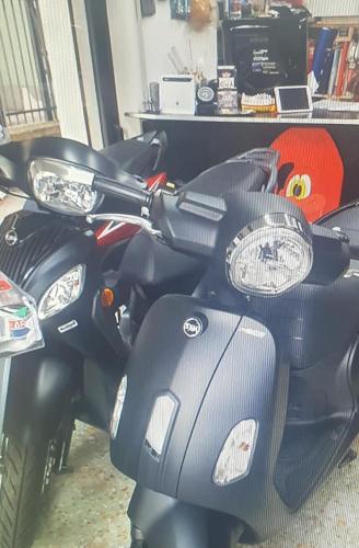 a row of motorcycles parked in a room at Palme CloseToGigante Junior Suites in Monterosso al Mare